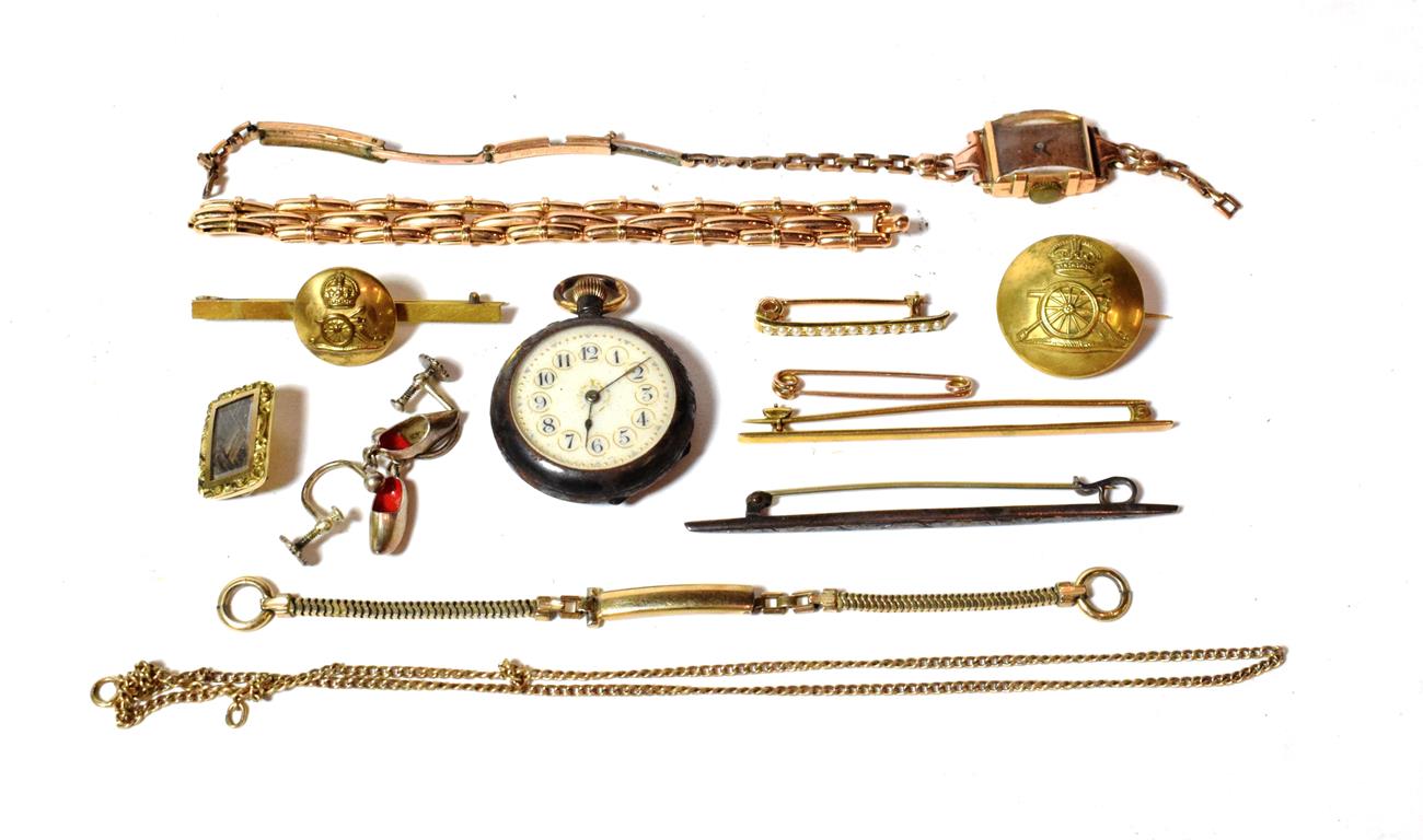 An 18 carat gold ladies' wristwatch on plated strap (a.f.); a safety pin stamped '9CT'; a