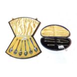 A cased set of six George V enamelled silver teaspoons, two by Henry Clifford Davis, Birmingham,