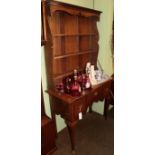 A George III oak dressing table fitted three drawers above an arched apron, 100cm wide; and an