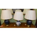 A modern Chinese blue and white table lamp, with pleated shade; and a pair of Chinese style blue and