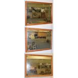 Three modern pine framed bevelled glass mirrors