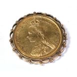 A gold five pound coin mounted as a brooch, diameter 4.2cm . Mount stamped '9CT'. Drilled so coin