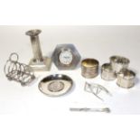 A collection of silver, including: a George V silver-mounted timepiece, by Adie Brothers,