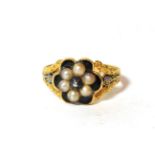 A Georgian 18 carat gold enamel and seed pearl mourning ring, finger size Q. Gross weight 3.3 grams.