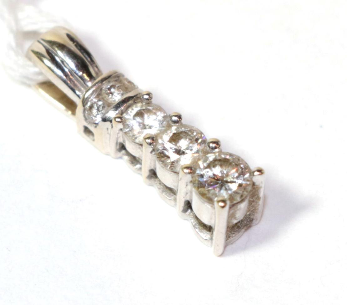 A diamond set pendant, stamped '750', length 1.7cm . Total estimated diamond weight 0.45 carat