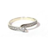 A diamond solitaire ring with diamond set shoulders, stamped '14K', finger size L1/2. Gross weight