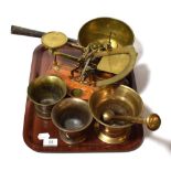 Three pestle and mortars together with a set of postage scales and weights and a brass pan