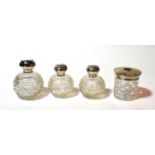A pair of Edward VII silver-mounted glass scent-bottles, the globular body hob-nail cut, the