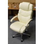 A modern cream leather and chrome executive office armchair