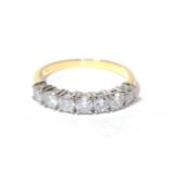 A diamond seven stone ring, finger size M. Gross weight - 2.78 grams.