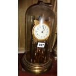 German brass clock under glass dome