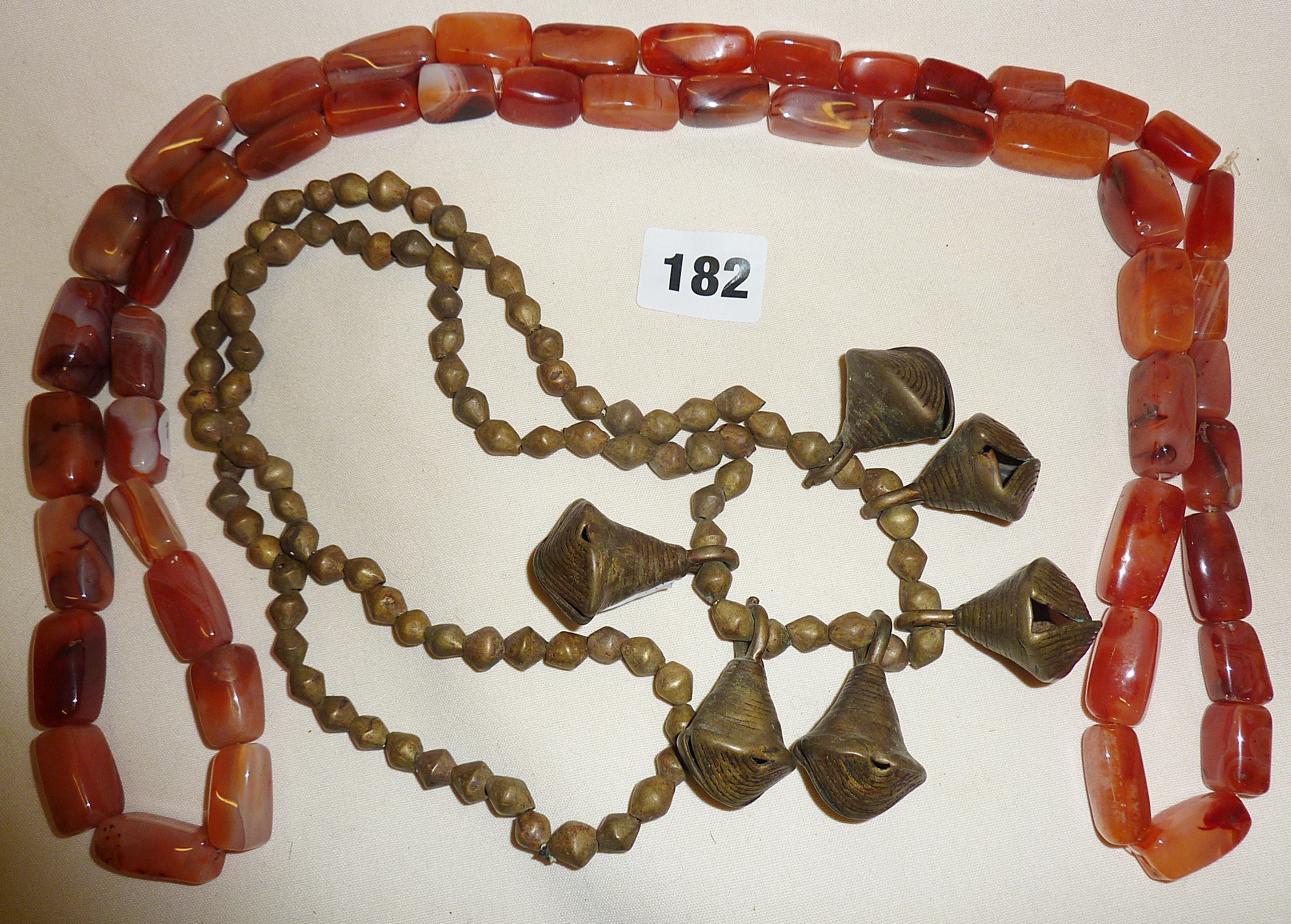 Tribal Art - two necklaces of polished stone and bronze bells