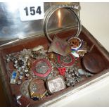 Plated casket containing assorted jewellery, enamel badges etc., some silver