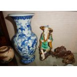 Chinese porcelain blue and white vase, a Mudman figure, another vase and a carved hardstone lion