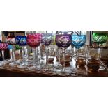 Large quantity of cut glass stemmed wine glasses with coloured bowls and an ERII glass commemorative