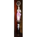 Regency fixed fan or face screen handle decorated with a porcelain lady figure and moulded