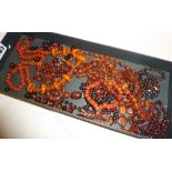 Collection of amber bakelite and amber-type jewellery, consisting of necklaces and beads