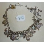 Heavy silver charm bracelet or necklace with many charms - some hallmarked - others possibly