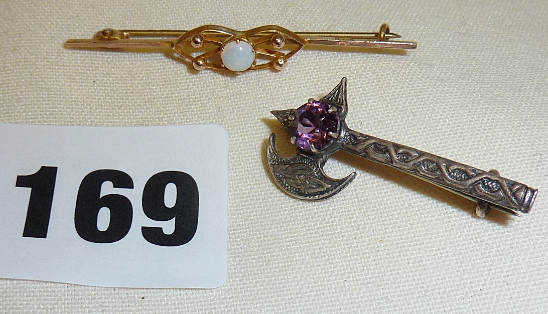 9ct gold bar brooch set with an opal, and a silver Celtic axe brooch