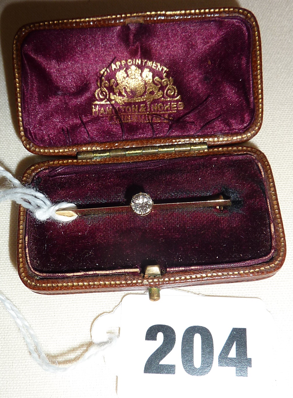 Edwardian gold bar brooch with solitaire diamond in case