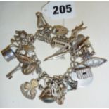 Vintage silver charm bracelet with many charms, some hallmarked, some Continental silver