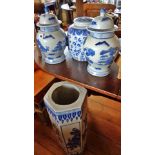 Three modern Chinese blue and white lidded jars (A/F) and a similar stick stand (A/F)