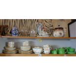 Two shelves of china and glassware, inc. child's tea set