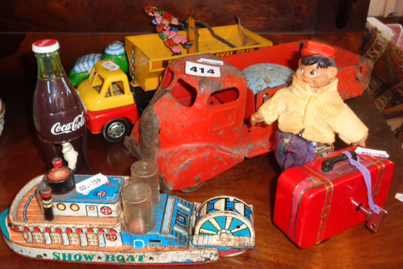 Tin plate "Showboat" toy, clockwork toy man running with suitcase, pre-war push along tin lorry