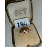 Gold ring set with diamonds and rubies, with tightening band and Liberty of London ring box, ring