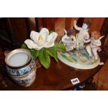 Porcelain cherub group, large flower and Losol Ware vase