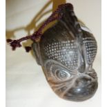 Tibetan ceramic bell in the form of a monkey's head (12cm high), incised signature to base