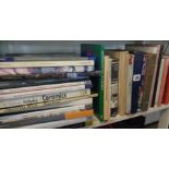 Shelf of books relating to antiques, stamps, model soldiers, etc.