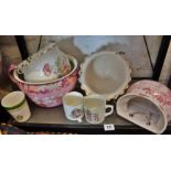 Pair of Victorian floral painted china hanging jardinieres, a pink floral decorated chamber pot,