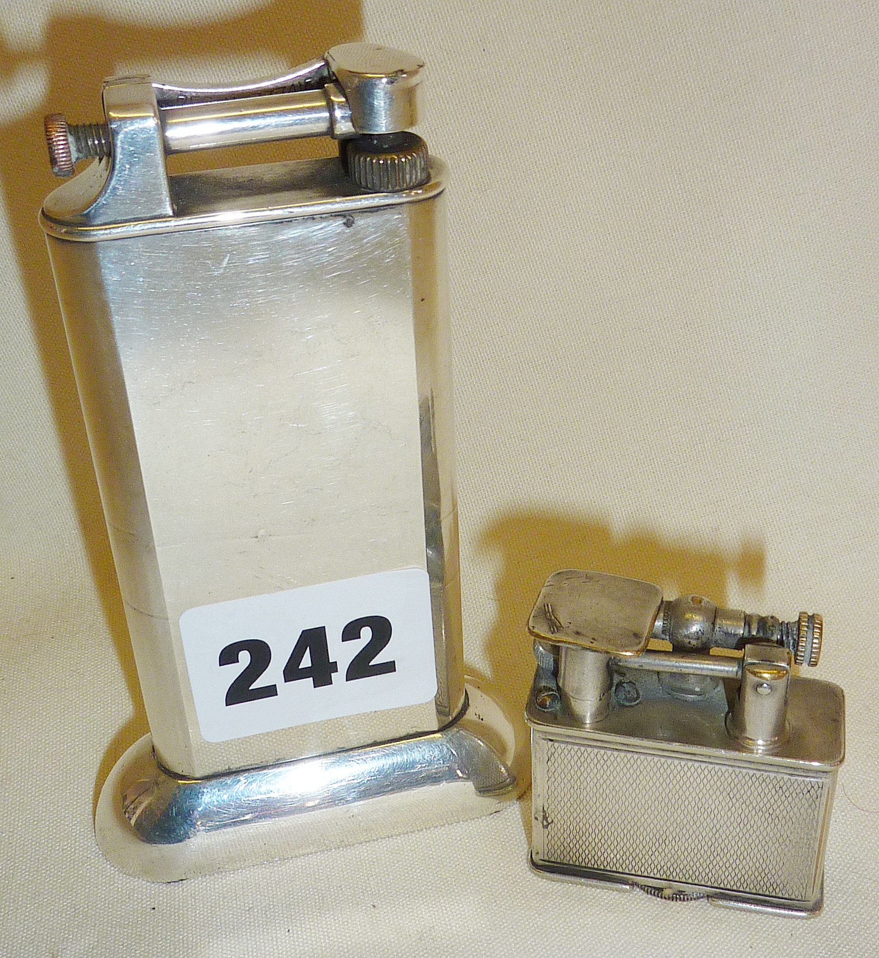 Dunhill silver plated table lighter and a Parker Beacon silver plated lighter