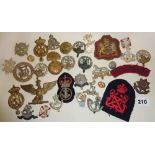 Assorted military cap badges, inc. WW1 and WW2