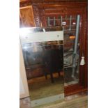 Art Deco rectangular wall mirror and a carved corner cupboard fitting with glazed door