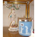 Continental porcelain figural two branch candlestick and a Wedgwood blue Jasperware biscuit barrel