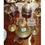 Hanging brass bell, pair of brass twist candlesticks and a pair of glass candlesticks