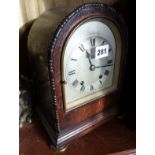 Oak cased dome topped mantle clock