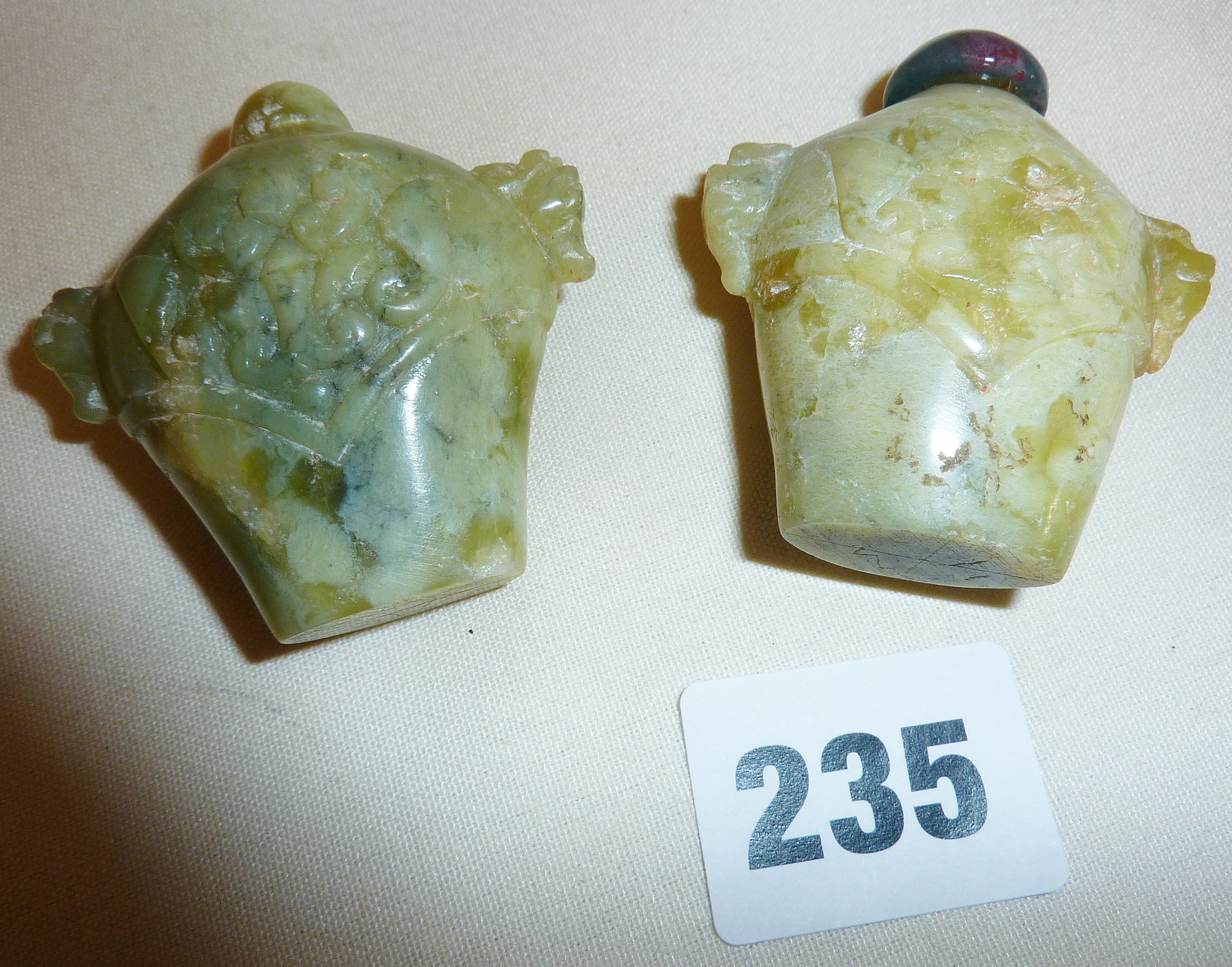 Two hardstone or spinach jade carved snuff bottles