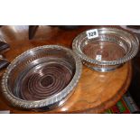 Two silver plated wine coasters