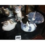 Four Royal Copenhagen china cat figurines - nos. 303, 071, 515 and 057