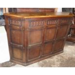 Oak shaped Jacobean style bar with panelled front and shelves behind