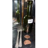 Two G.W.R Hotels silver plated forks, an L.M.S. Hotels green glass beer bottle, and two B.R.(W)