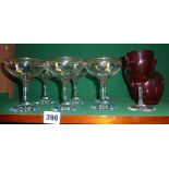 Six Babycham glasses, a Cranberry glass jug and a similar wine glass