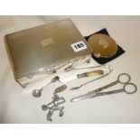 Silver plated cigarette box, with contents, inc. grape scissors, compact, sugar tongs etc.