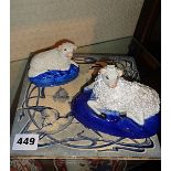 Two Staffordshire sheep and an Art Nouveau blue and white tile