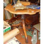 Victorian Gothic burr walnut occasional table with shaped top above carved centre column on tripod