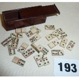 Miniature bone dominoes x 23 in a mahogany box with sliding lid
