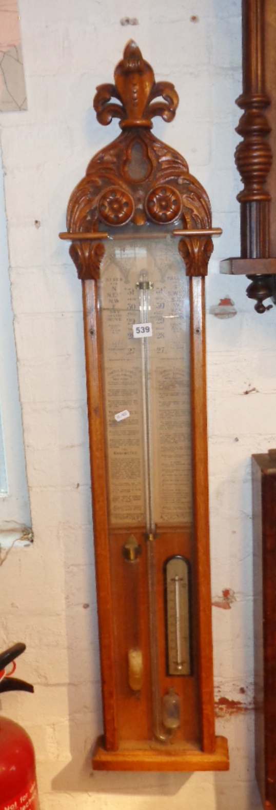 Admiral Fitzroy's Barometer with a carved pediment, brass slide indicators, original backpaper,